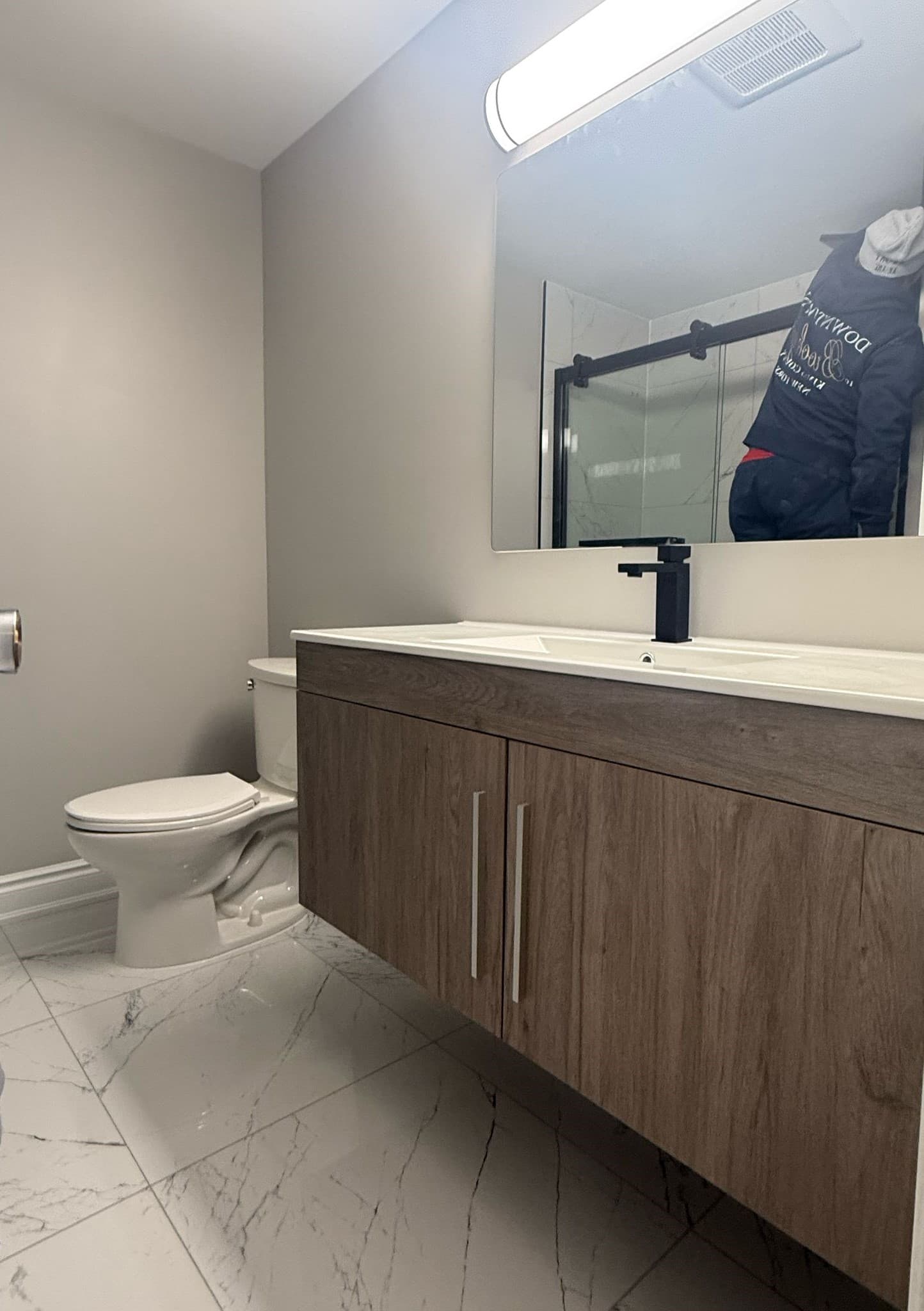 Renovated bathroom with freestanding tub and walk-in shower