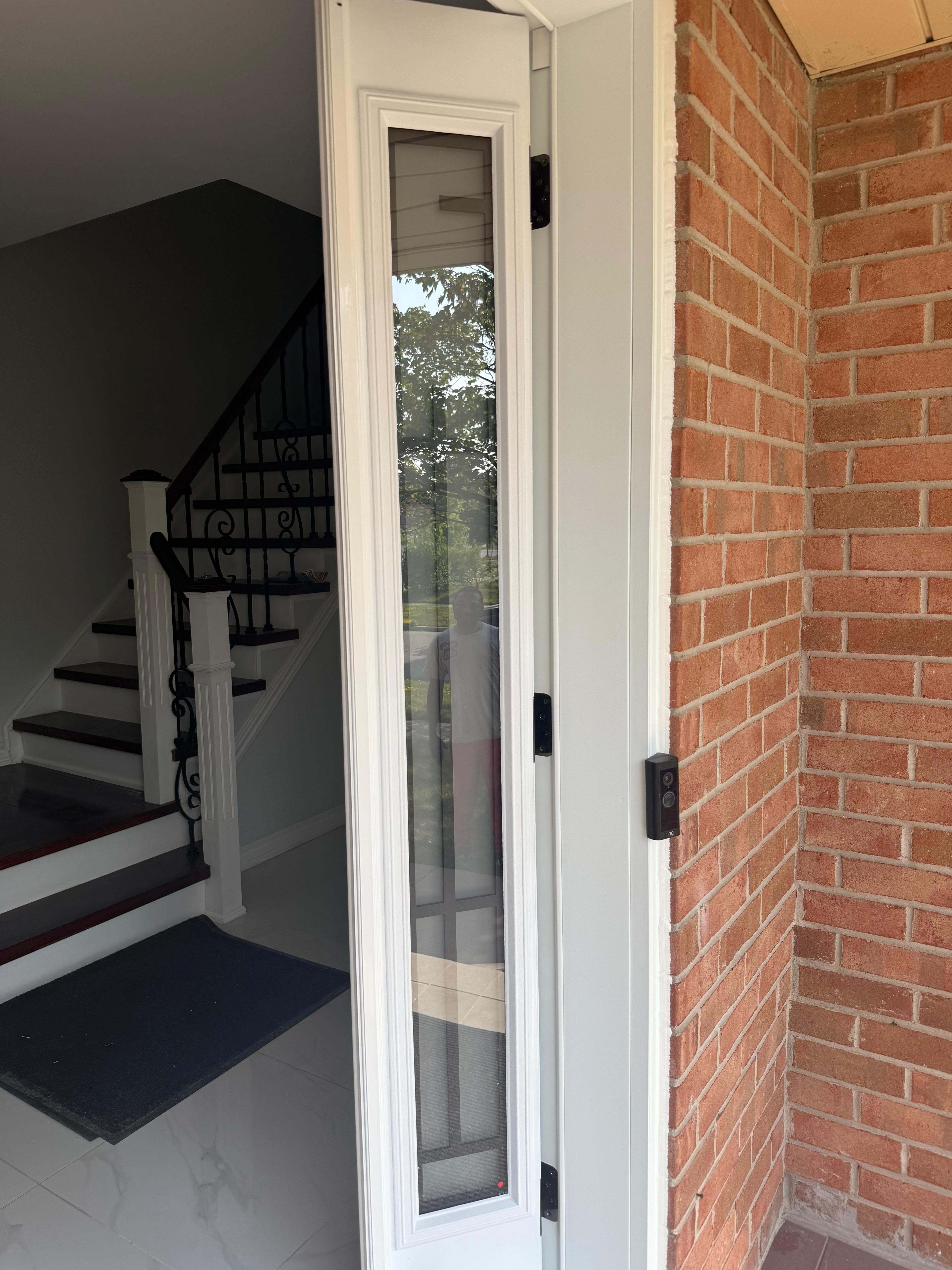Barn door and piano styled stairs in basement, door remodel main floor in Brampton (after)