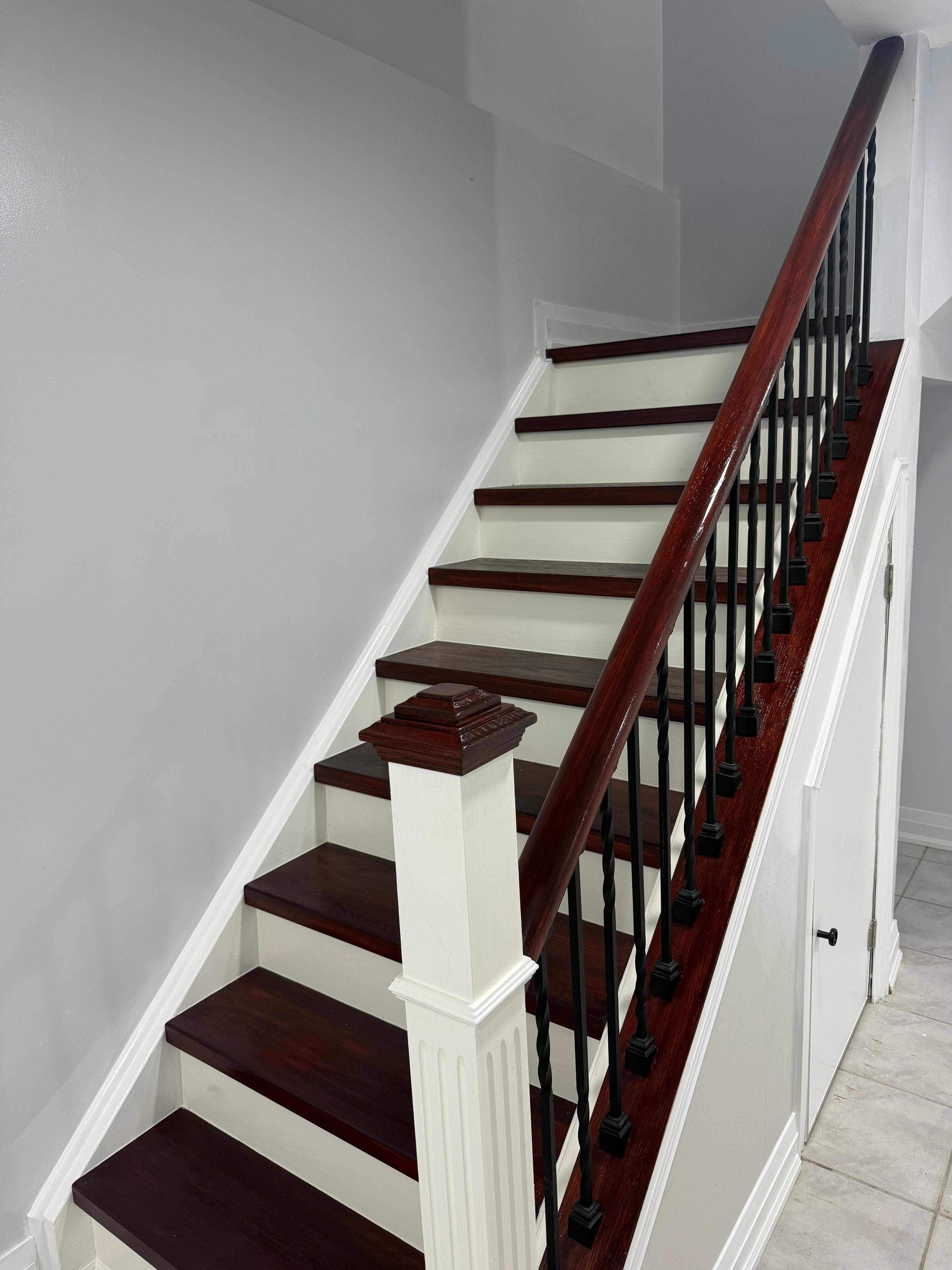 Barn door and piano styled stairs in basement, door remodel main floor in Brampton (after)