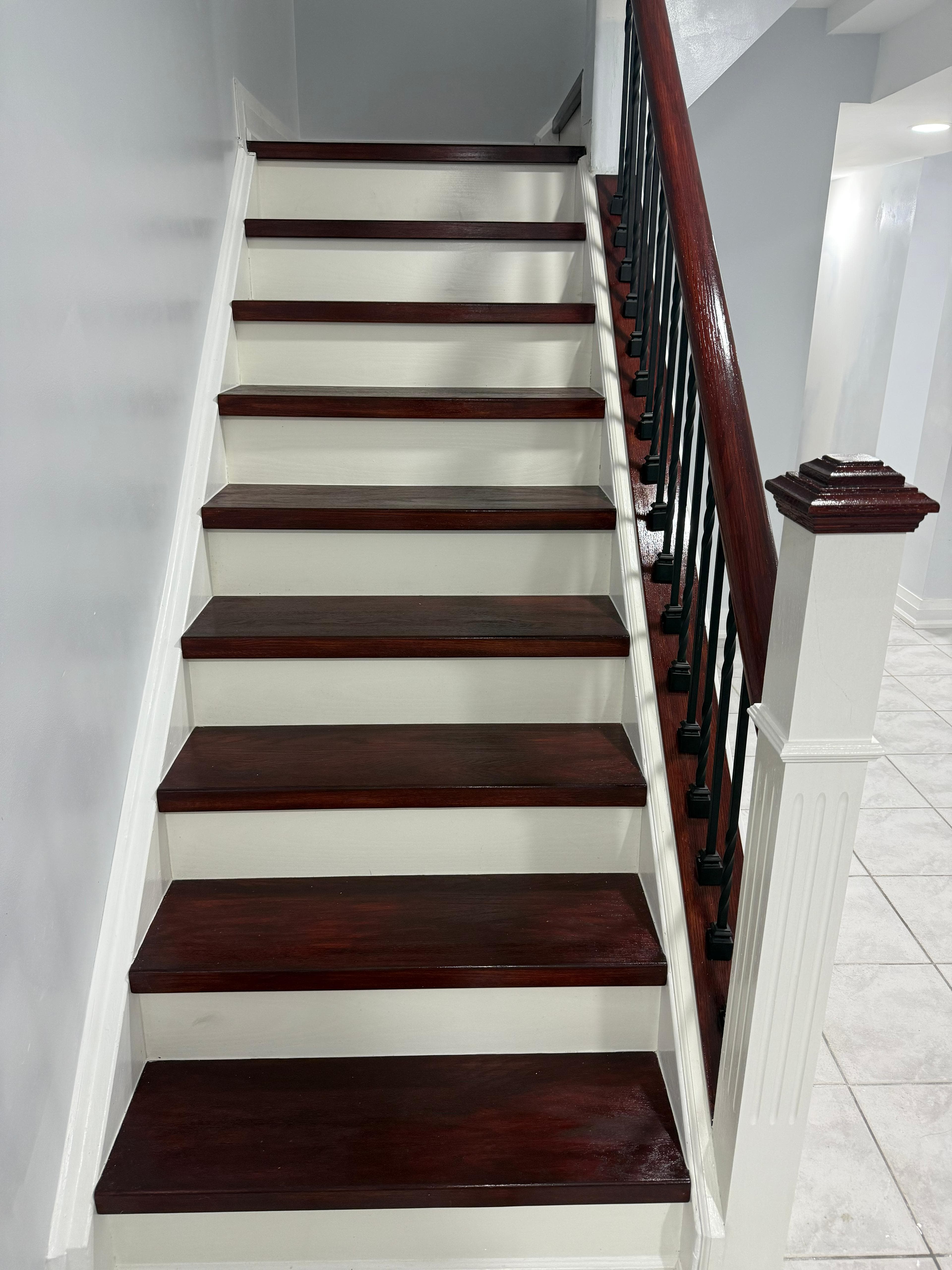 Barn door and piano styled stairs in basement, door remodel main floor in Brampton (after)