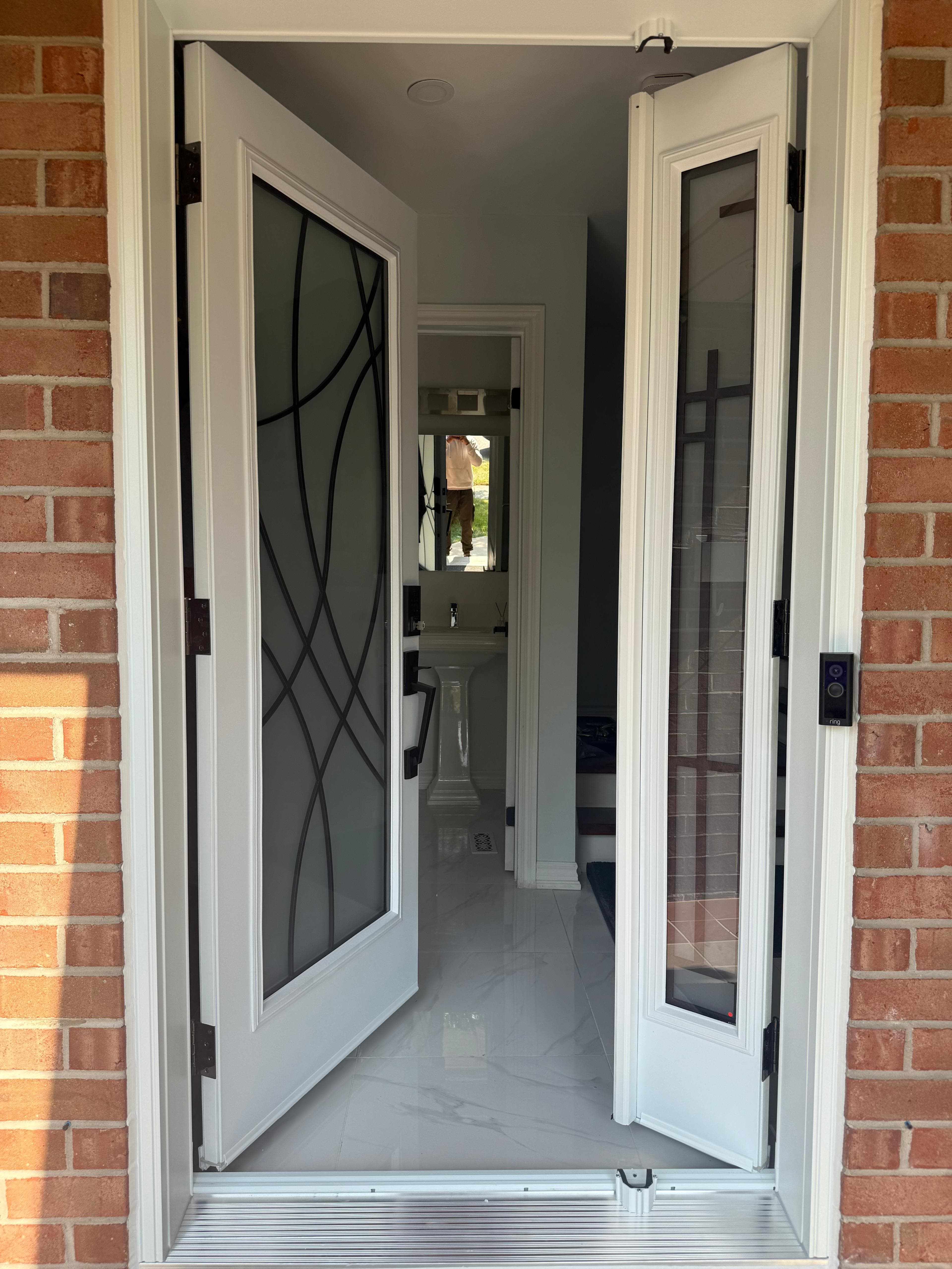 Barn door and piano styled stairs in basement, door remodel main floor in Brampton (after)